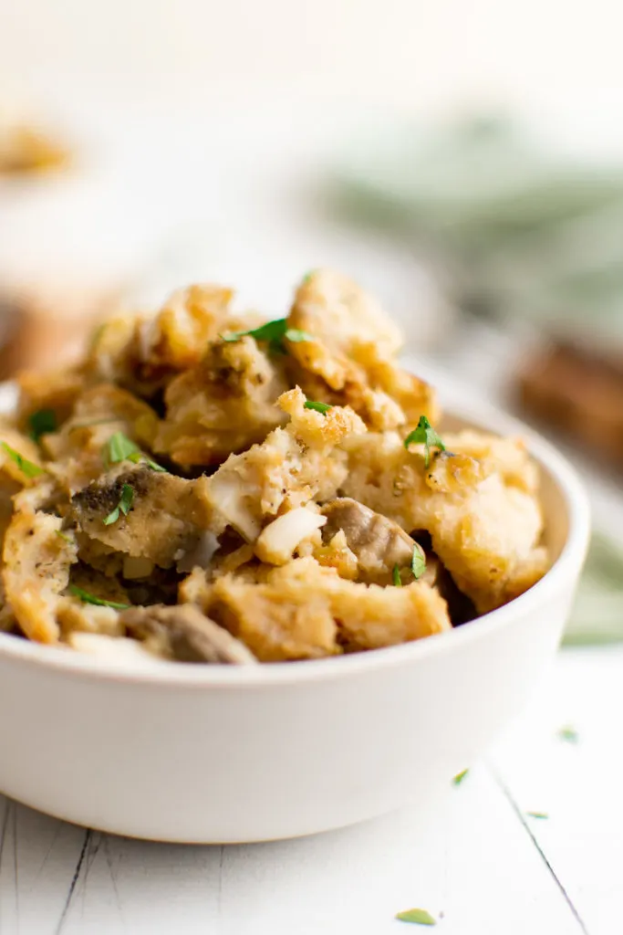 Close up view of sage stuffing in a bowl.