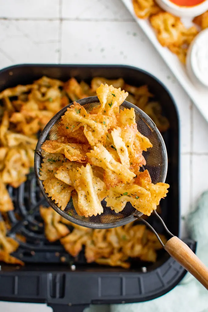 Pasta chips on a spatula.