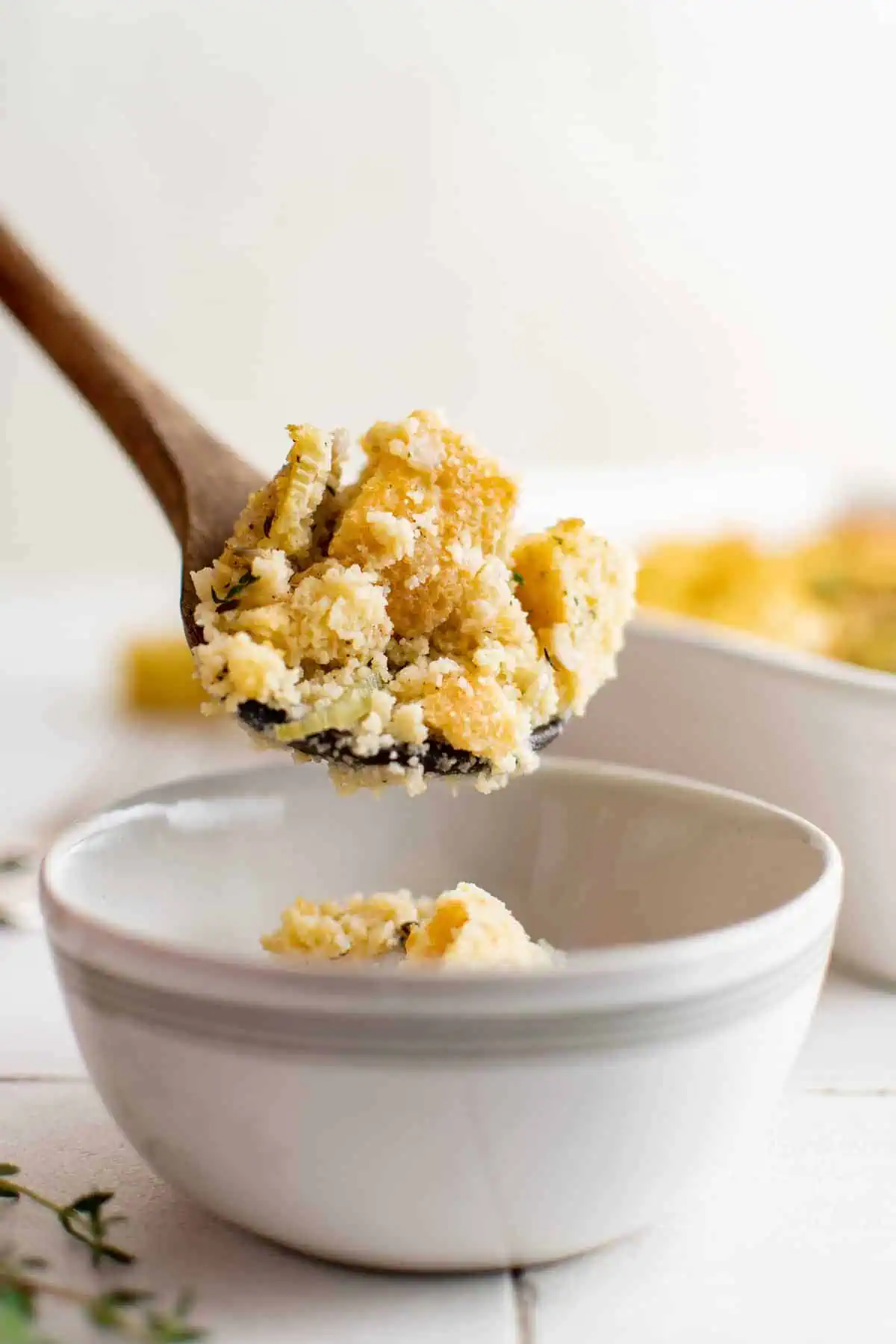 Serving spoon with a scoop of cornbread dressing.