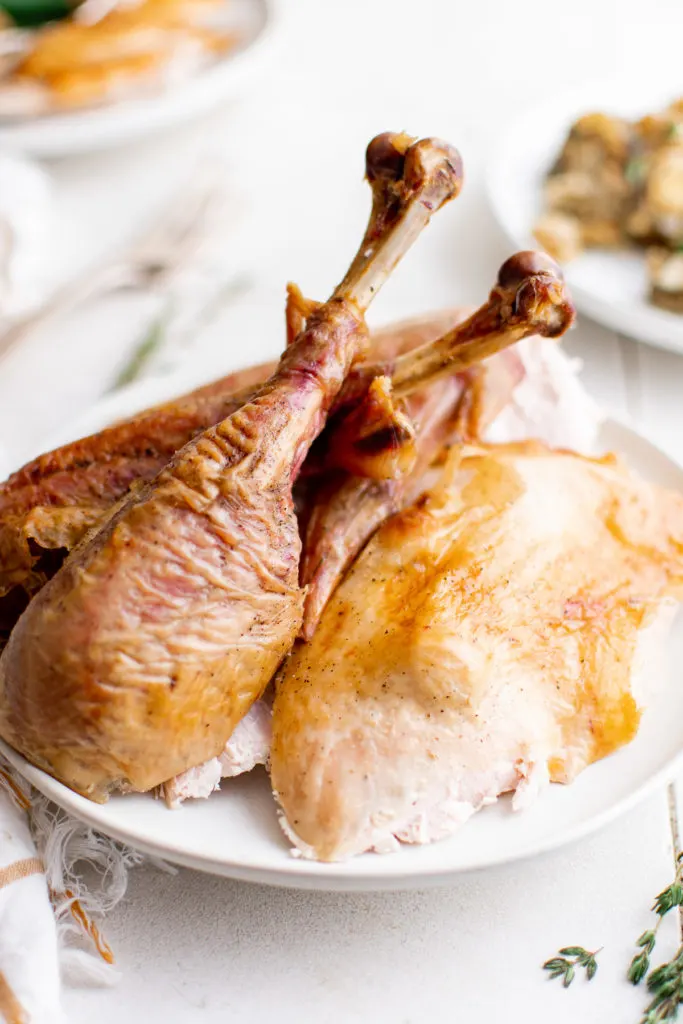 Turkey legs on a serving plate.