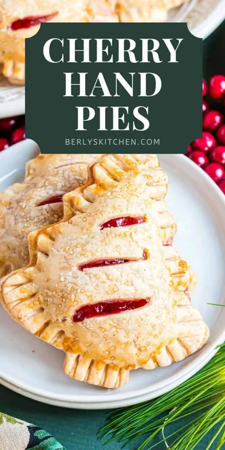 Close up of christmas tree cherry hand pies on a plate.