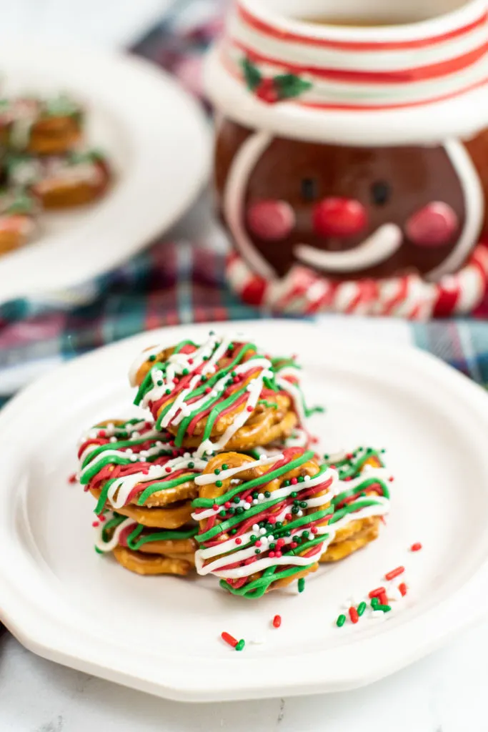 Stack of chocolate caramel pretzels on a plate.