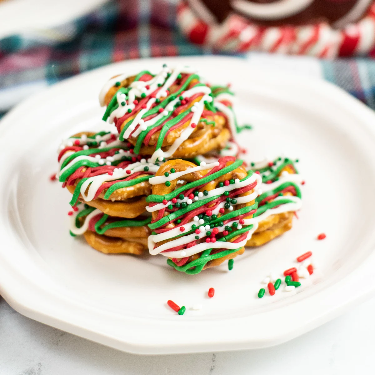 White plate with drizzled chocolate pretzels.