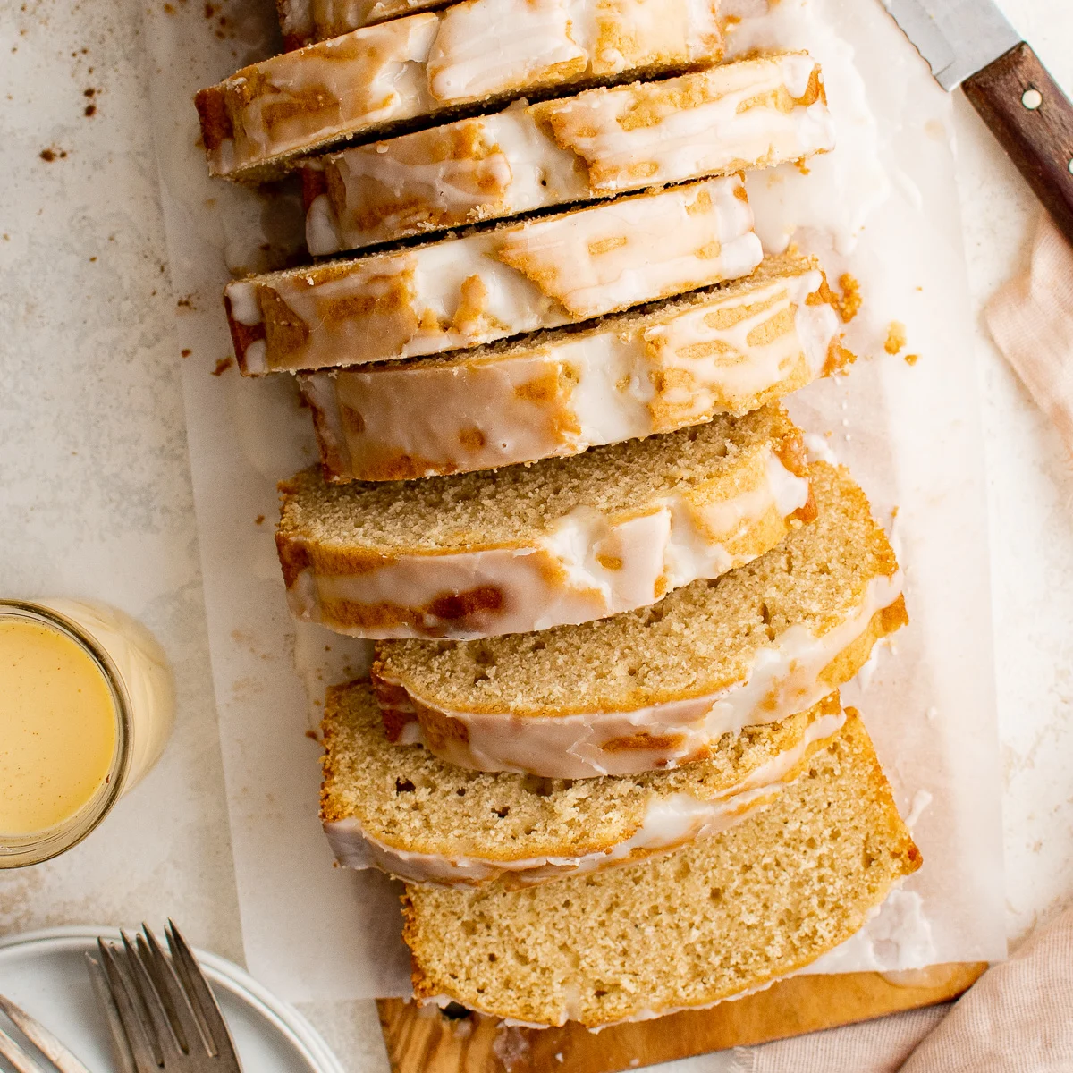 Top down view of sliced eggnog bread on a platter.