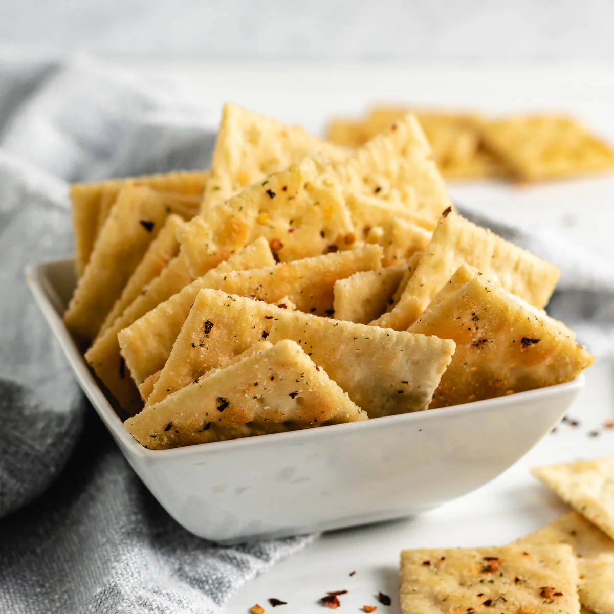 White bowl filled with spicy firecracker crackers.