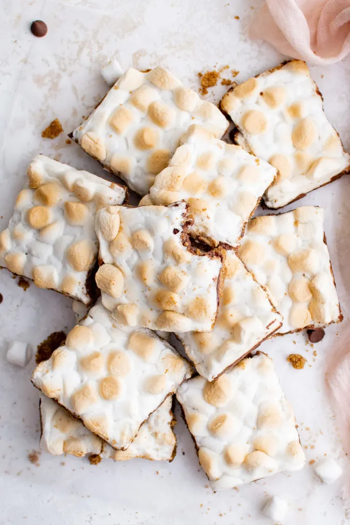 Top down view of a batch of s'mores bars with toasted marshmallows.