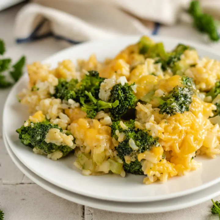 Broccoli rice casserole on two white plates.