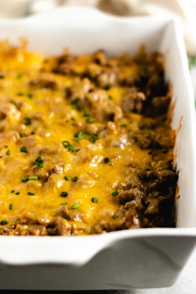 Close up view of sausage casserole in a pan.