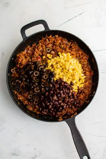 Corn and beans added to taco meat.