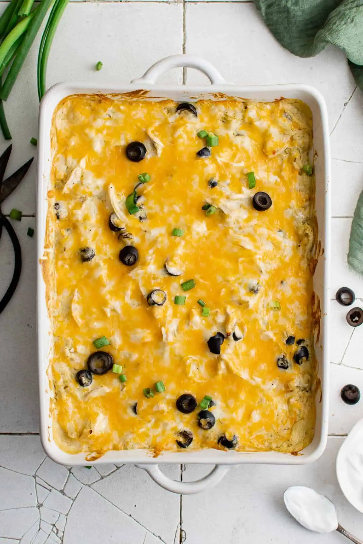 Top down view of green chile chicken casserole with olives.