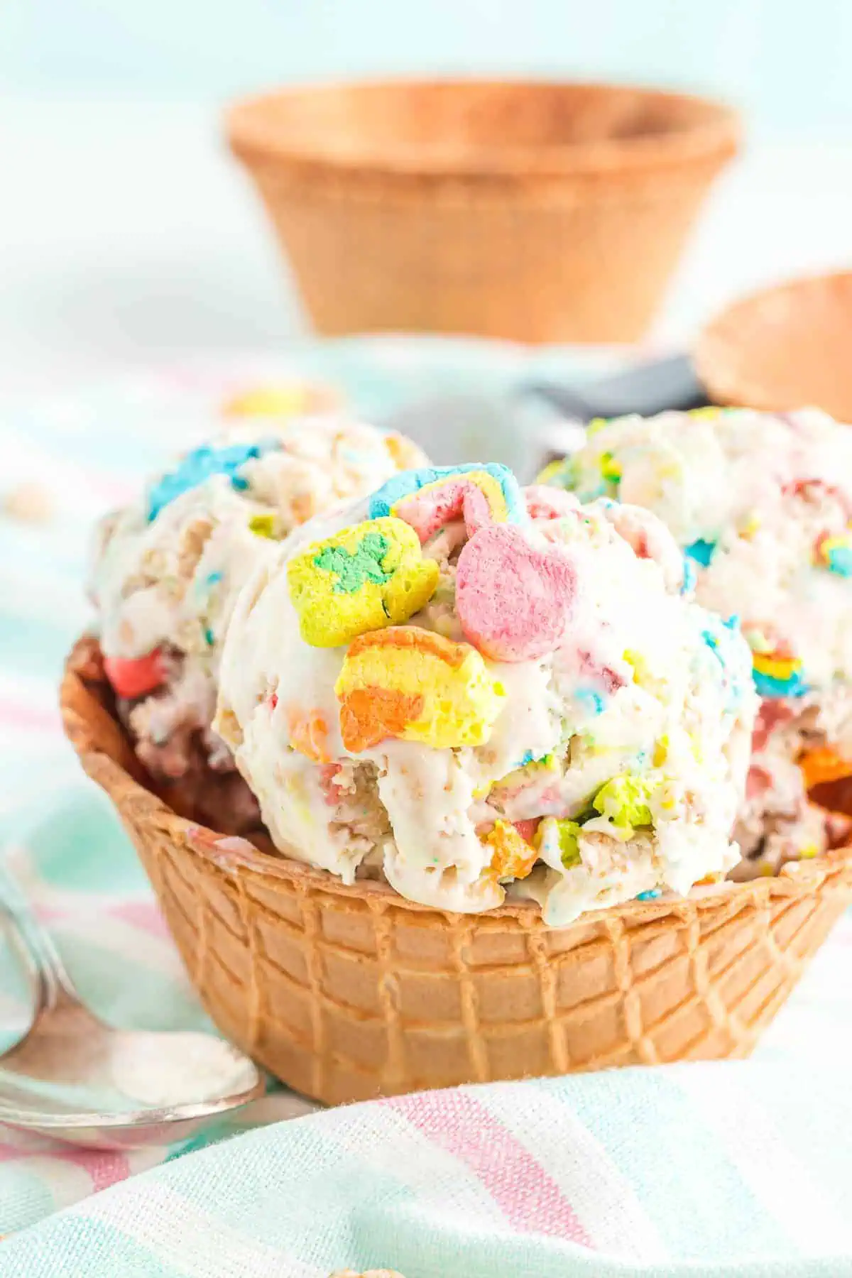 Waffle cone bowl full of ice cream.