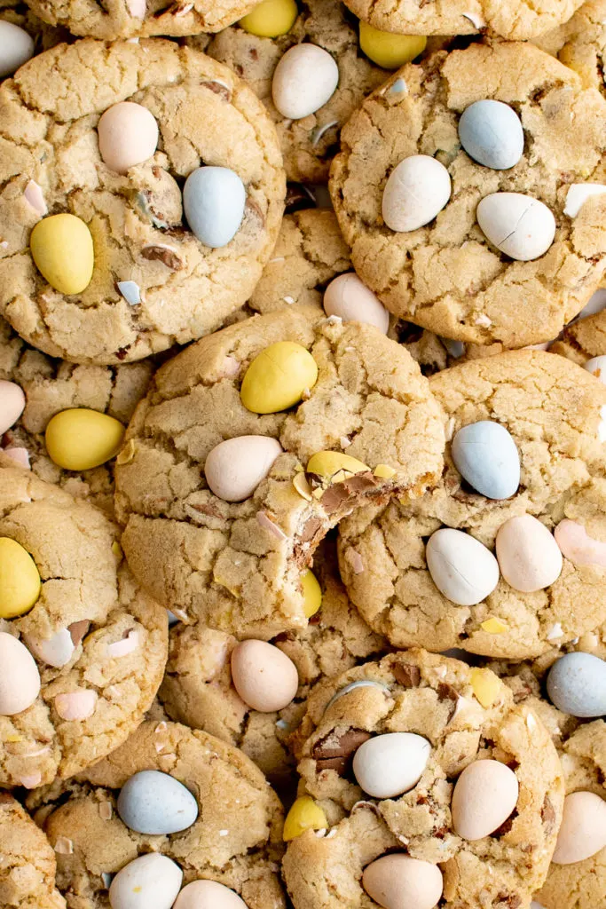 Top down view of a batch of cookies with candy.