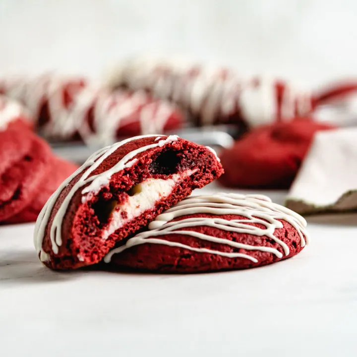 Red velvet cake mix cookie cut in half.