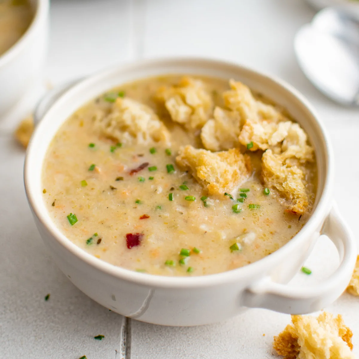 Croutons on to of potato leek soup.