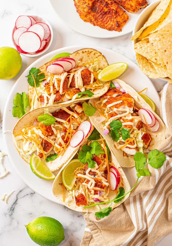 Top down view of a platter of fish tacos.