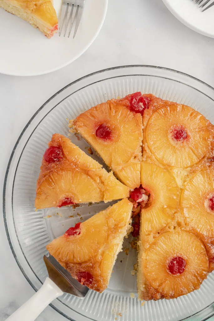 Whole pineapple upside down cake on a platter.