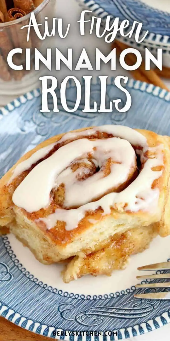 Close up view of a cinnamon roll on a plate.