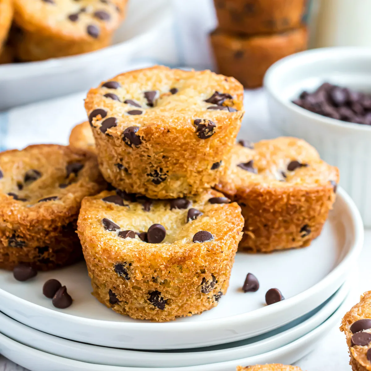 Stack of chocolate chip muffins on a plate.