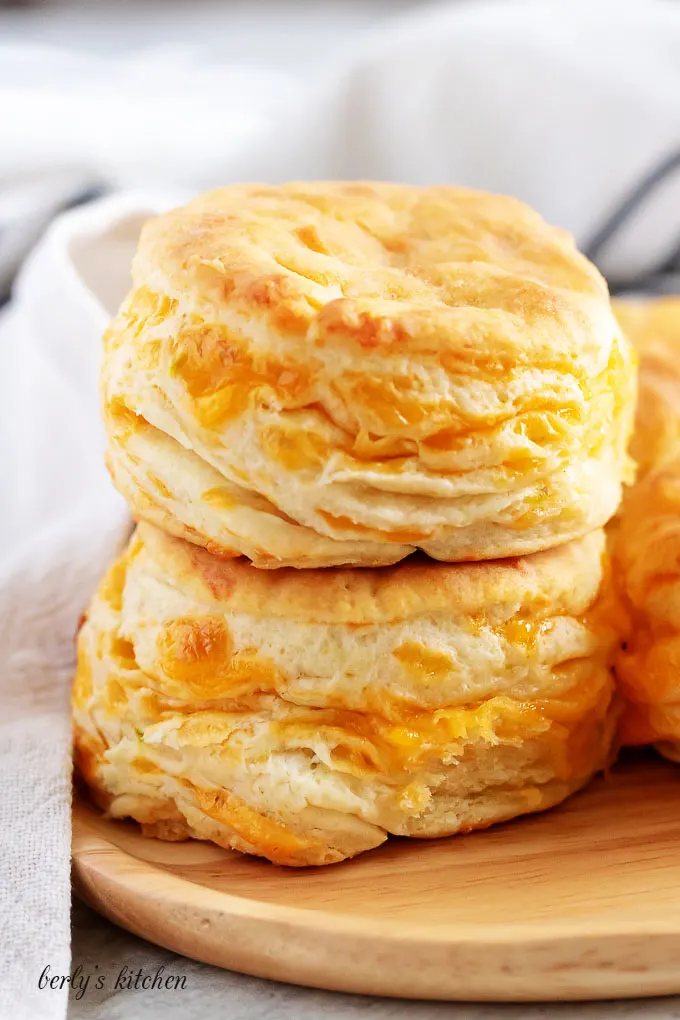 The final shot of three jalapeno cheddar biscuits on a plate.