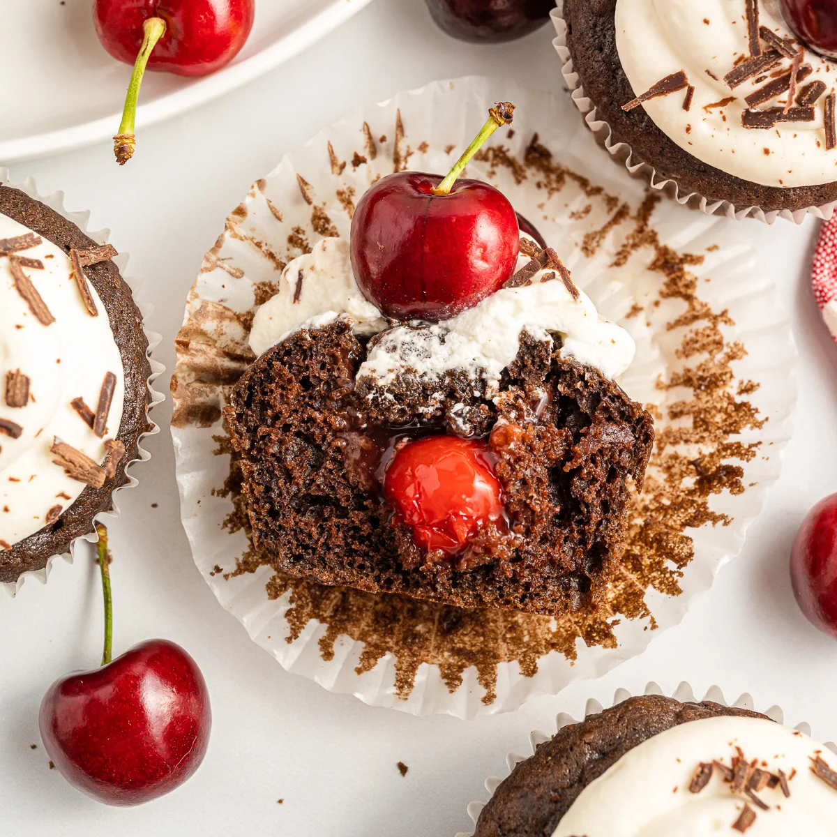 Top down view of a cherry inside a cupcake.