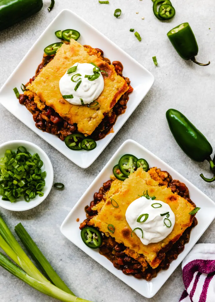 Top down view of two slices of chili cornbread casserole.