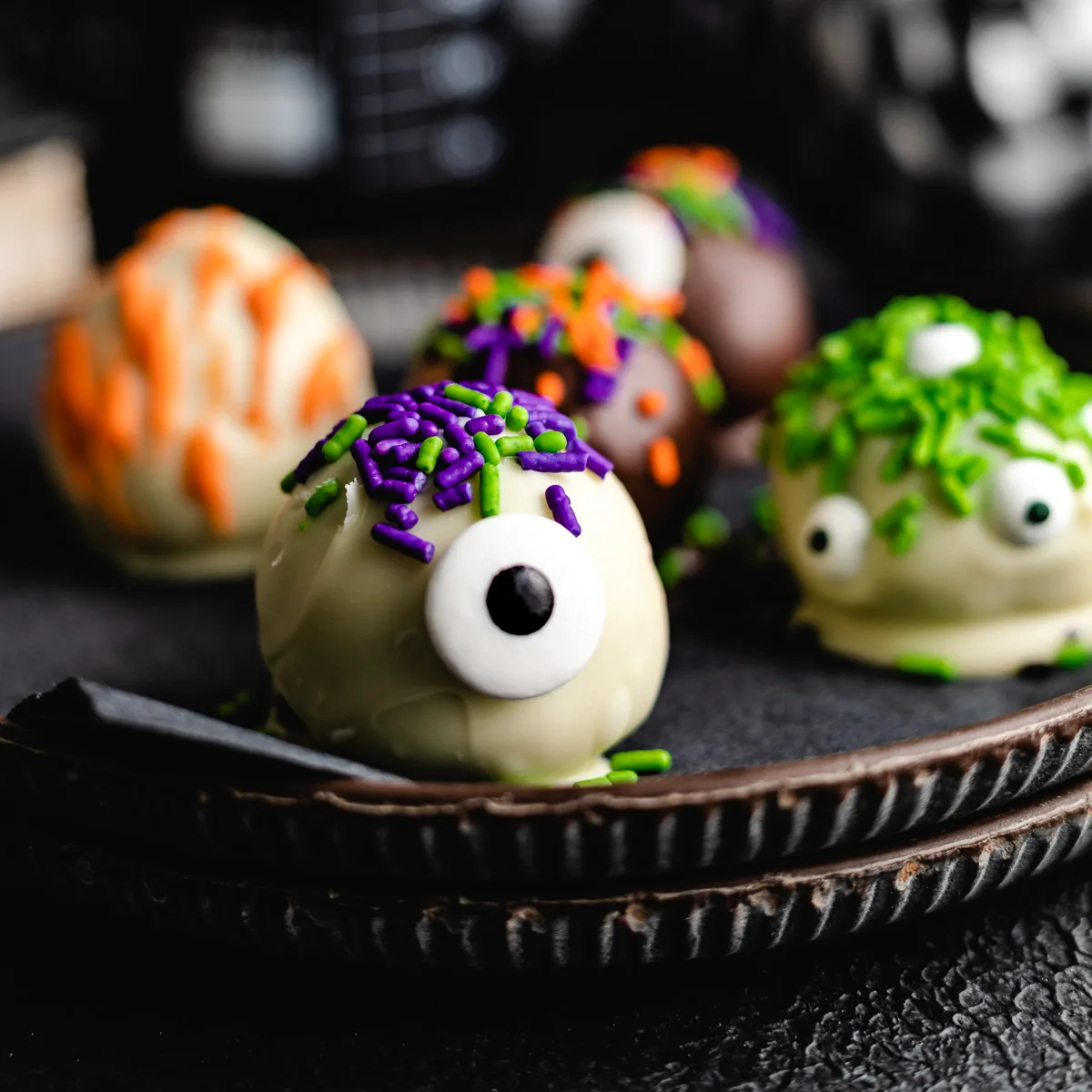 Halloween truffles on a plate.