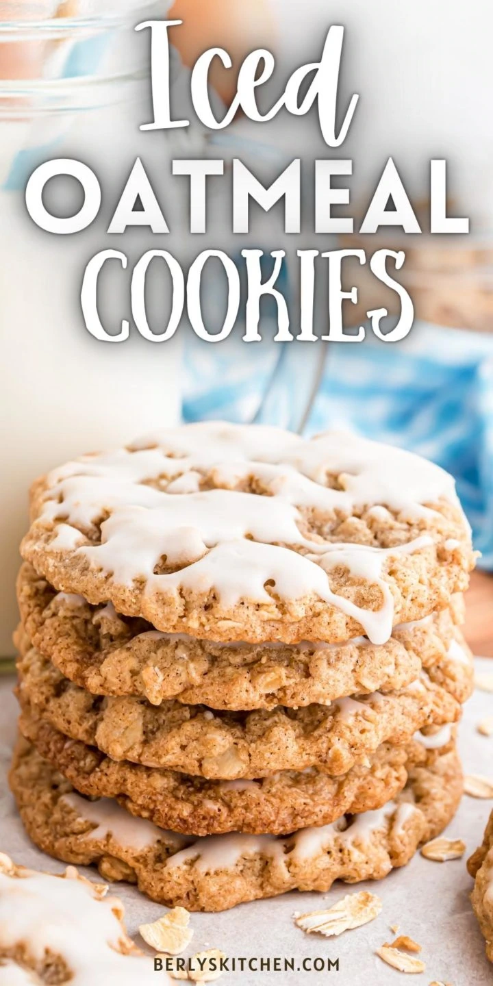 Close up view of a stack of iced oatmeal cookies.