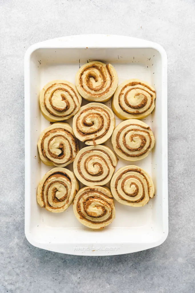 Canned cinnamon rolls in a baking pan.