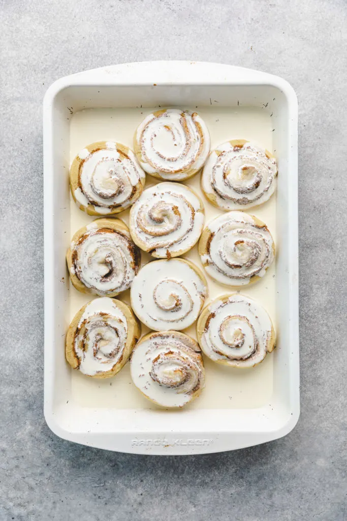 Heavy cream poured over sweet rolls with cinnamon.