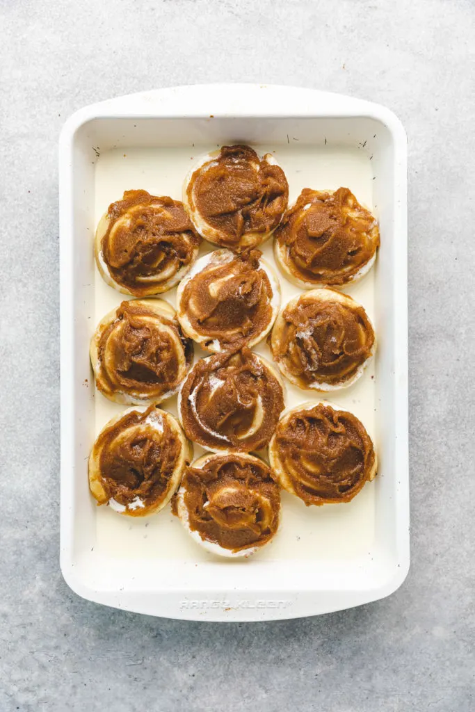 Cinnamon sugar mixture smeared over cinnamon rolls.