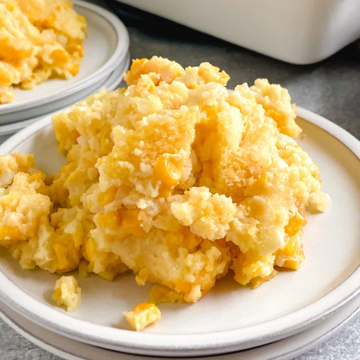 Scoop of casserole with corn on a plate.