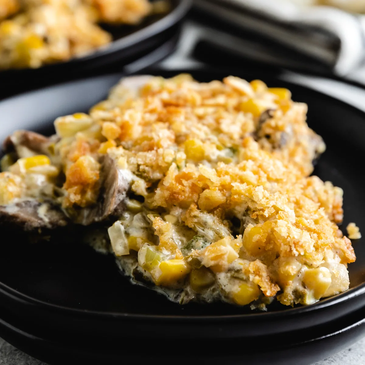 Close up of a scoop of casserole on a plate.