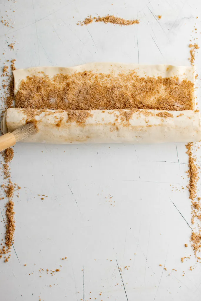 Puff pastry being rolled up.