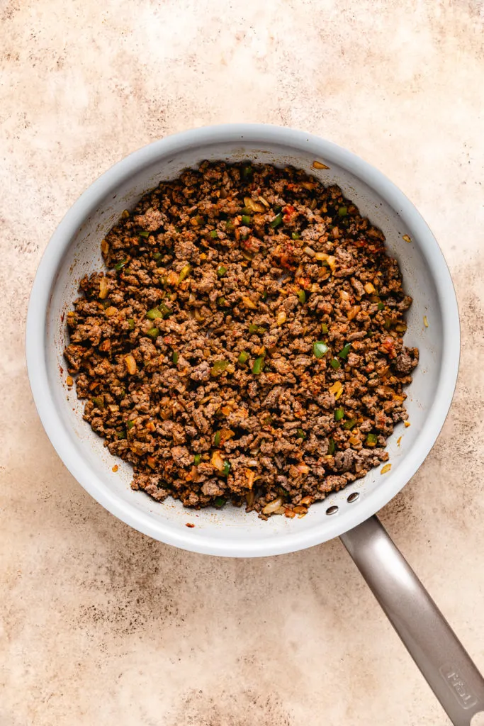 Ground beef with peppers, onions, and tomato paste.