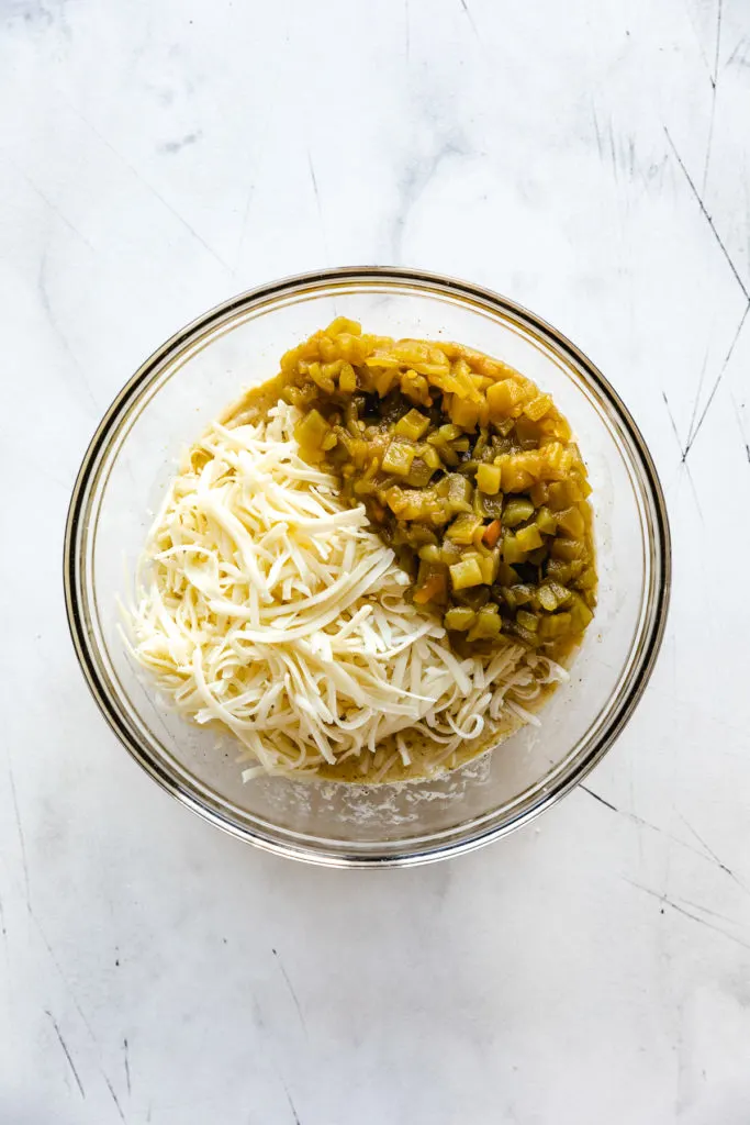 Green chiles and cheese on top of egg mixture.