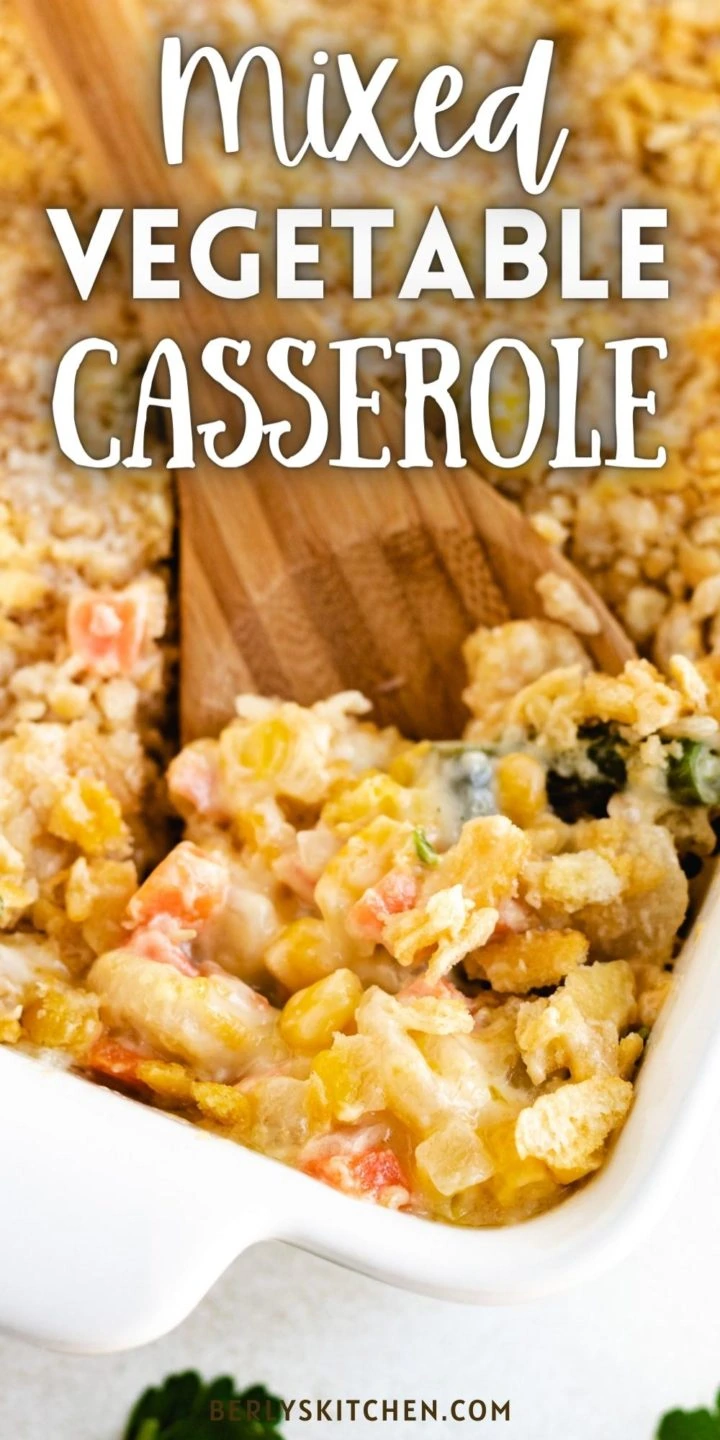 White casserole dish filled with mixed vegetable casserole.