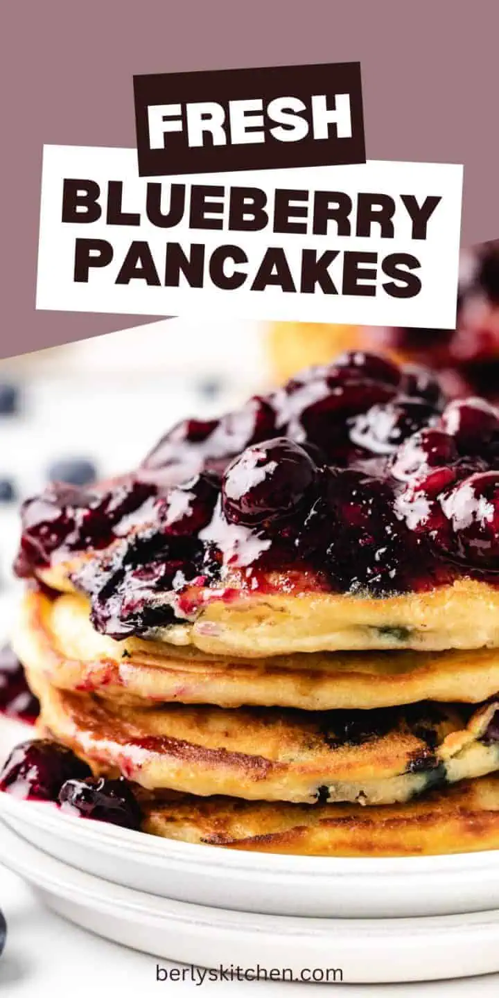 Close up view of several blueberry pancakes on plates.