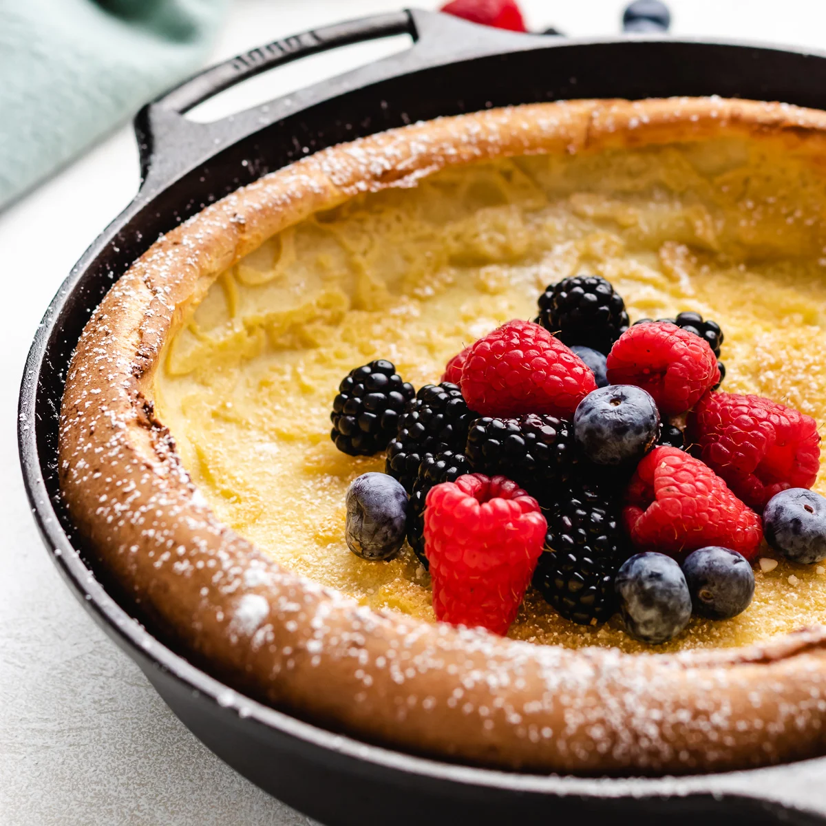 Close up view of a dutch baby in a pan.