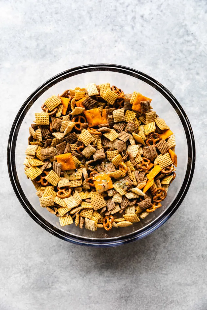 Seasoned butter poured over cereal mix.