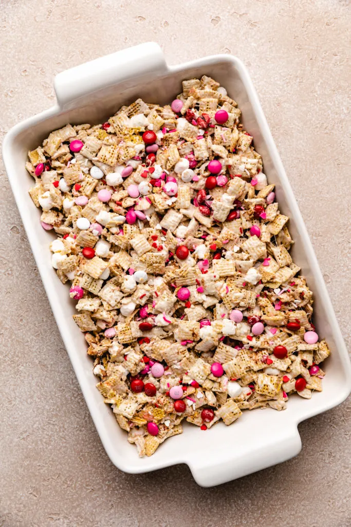 Top down view of cereal bars in a white pan.