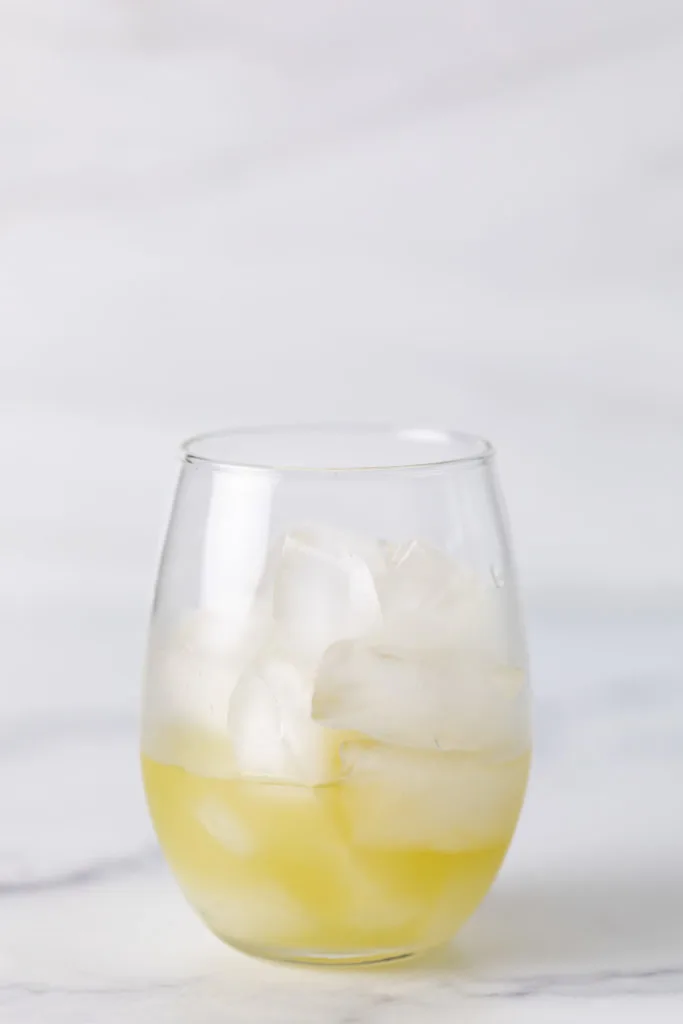 Coconut rum and pineapple juice in a glass.