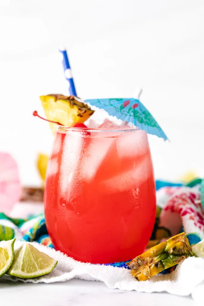 Blue umbrella and garnishes on a bahama mama.