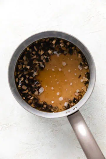 Milk and flour poured into mushrooms and broth.