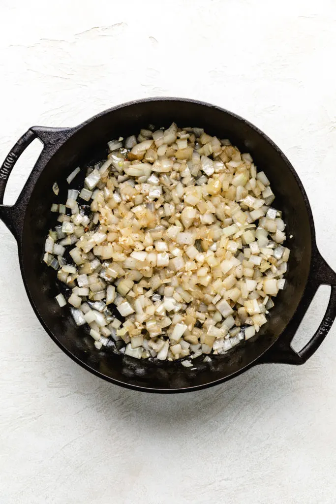 Sauteed onions in a pan.