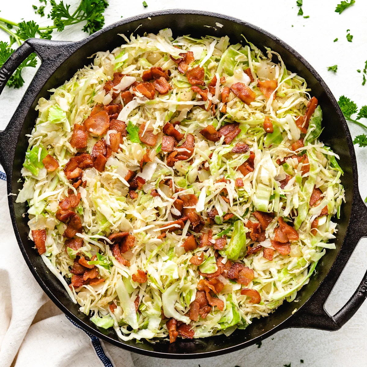 Close up view of southern fried cabbage with bacon.