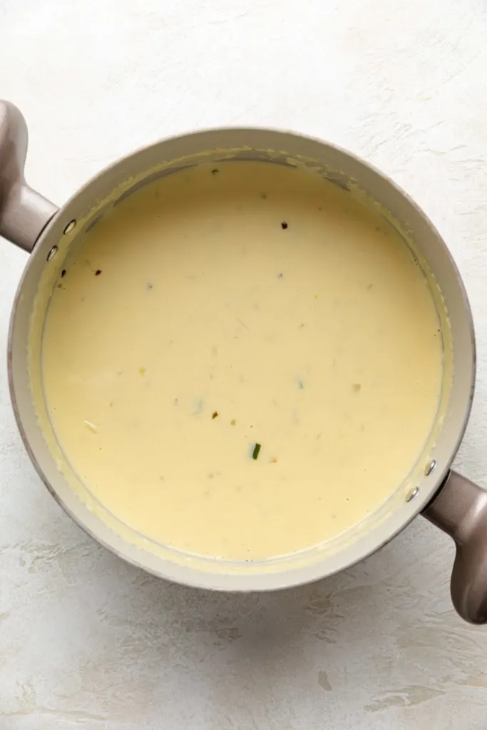 Cheese melted into a pan of half and half.