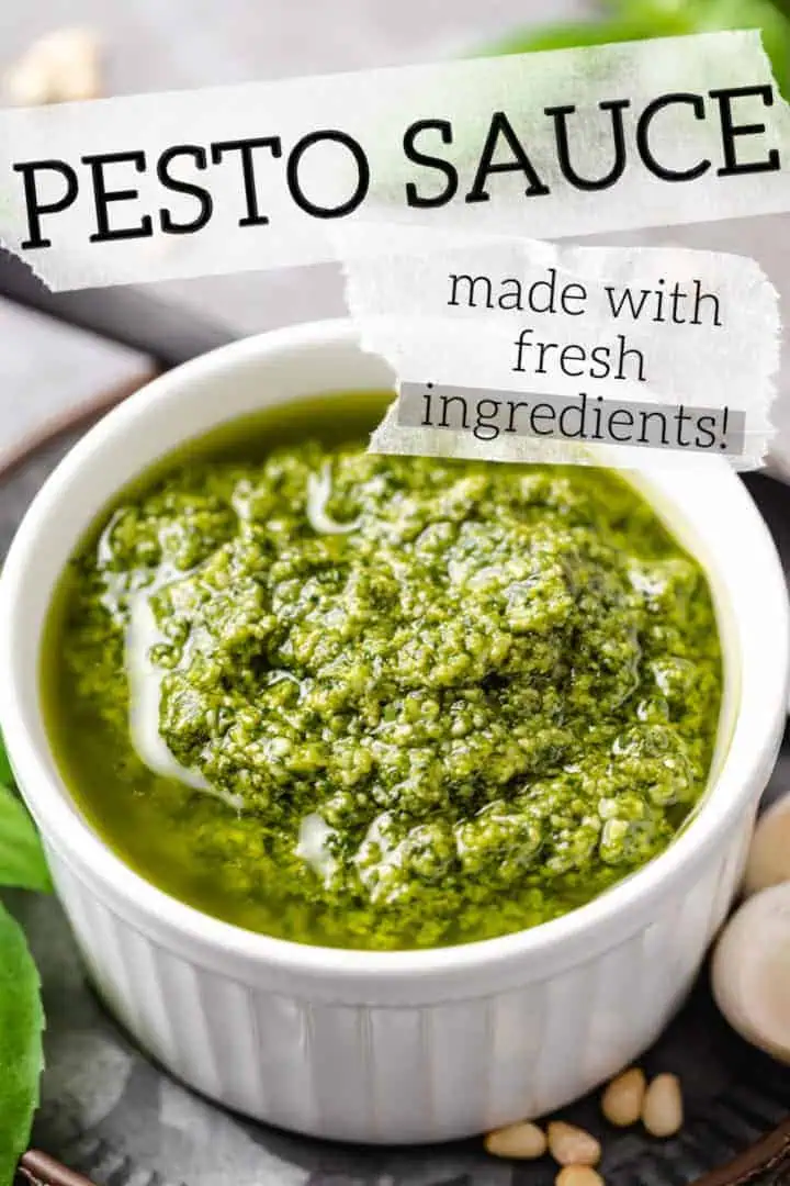 White bowl filled with basil pesto sauce.