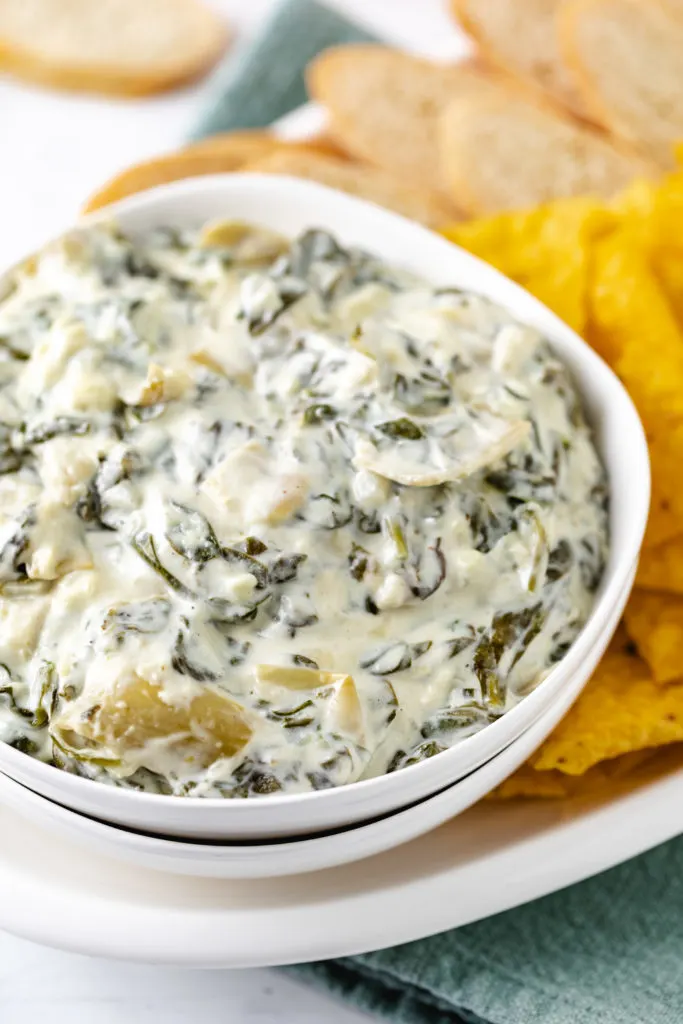 Spinach artichoke dip in a bowl.