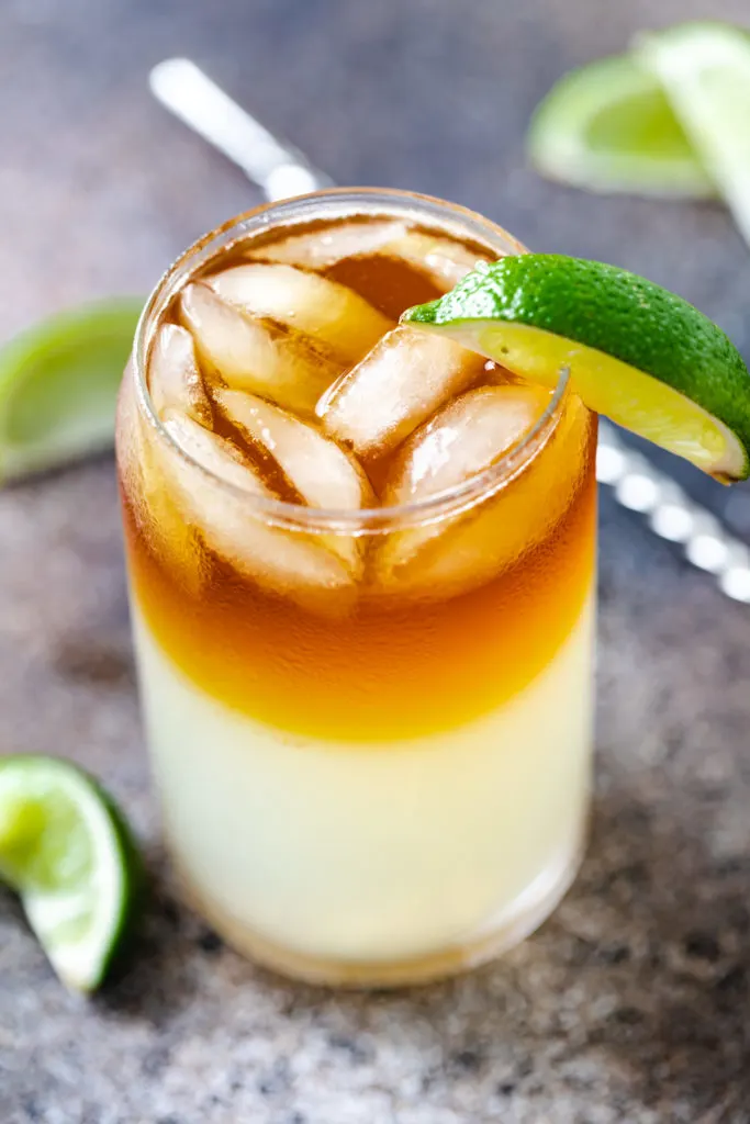 Close up of a ginger beer and rum cocktail in a glass.