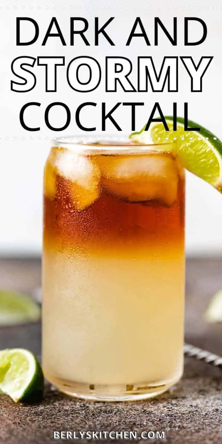 Side view of a ginger beer and rum drink with a lime.